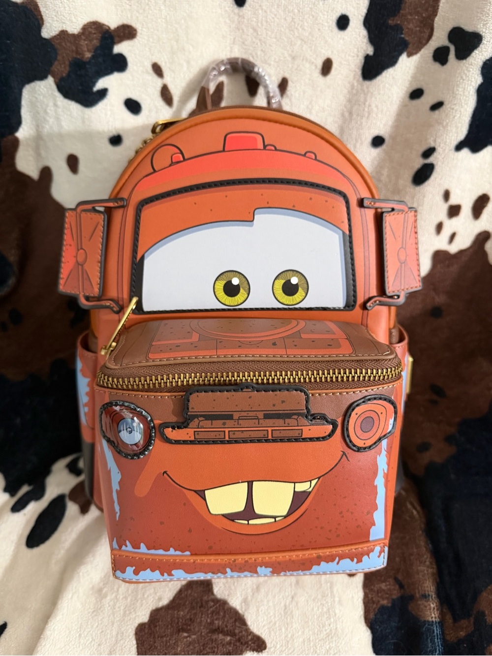 Loungefly Orange Tow Mater Mini Backpack with Character Face